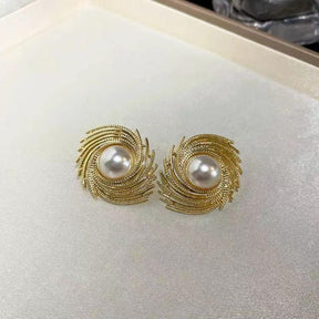 Pearl spiral earrings.