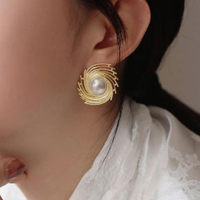 Pearl spiral earrings.