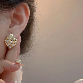 Triangle stone beaded earrings.