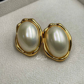 White pearl earrings.